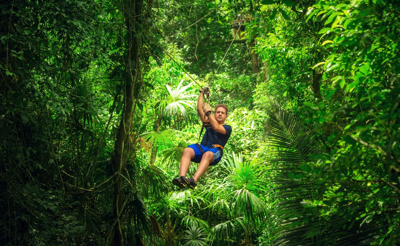 man during a Zip-line Tour costa rica