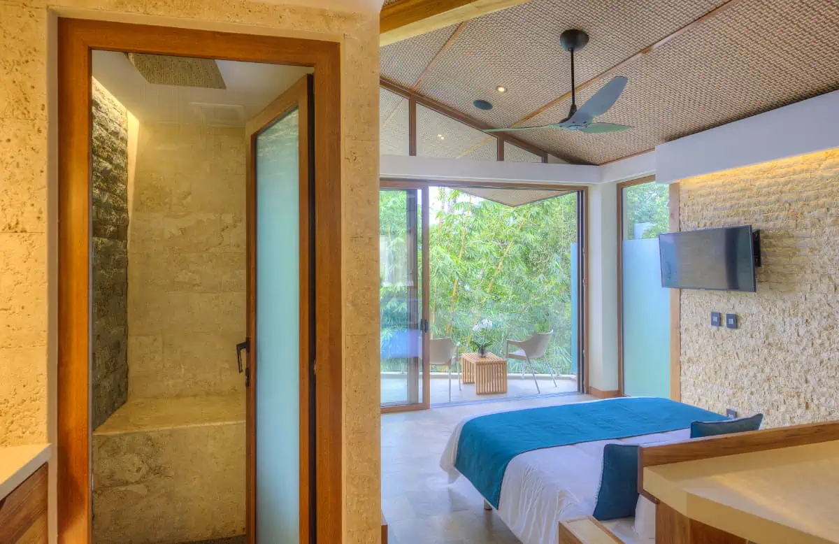 Luxury bedroom suite with private balcony and rainforest views at Villa Punto de Vista, Costa Rica