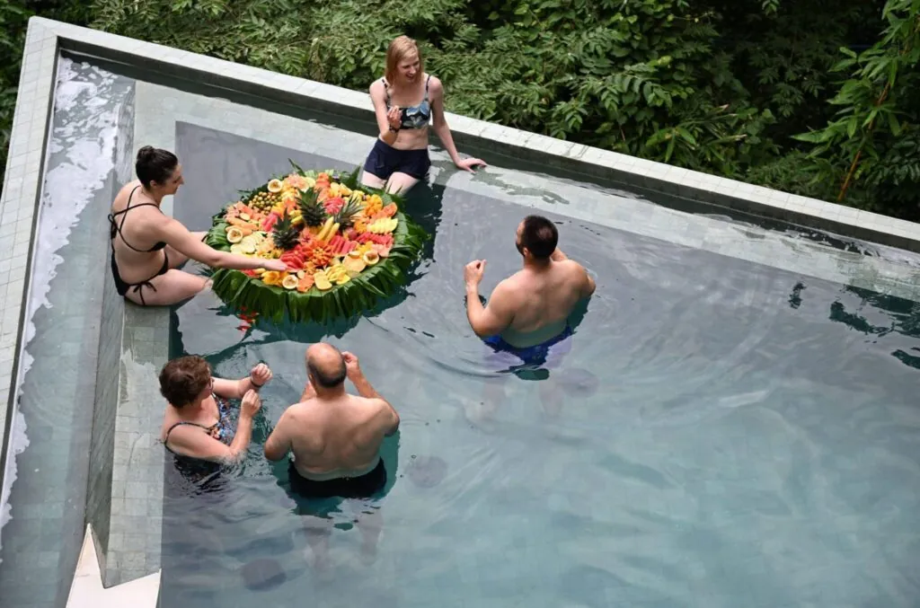 Group enjoying an infinity pool at a luxury villa in Costa Rica